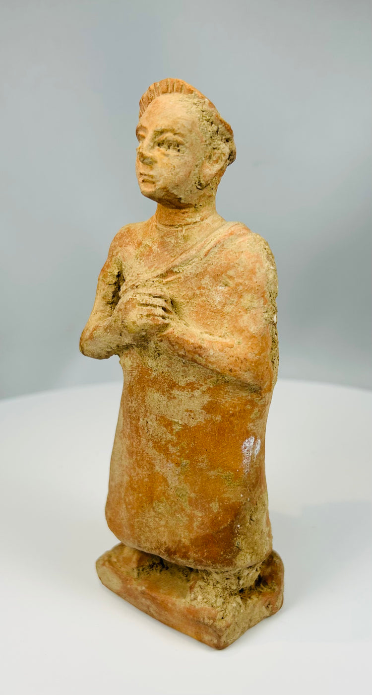 Stylized terracotta male sculpture with simplified features