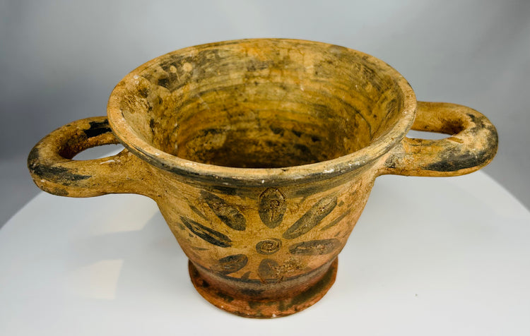 Archaic period Etruscan pottery vessel with twin handles and pedestal foot