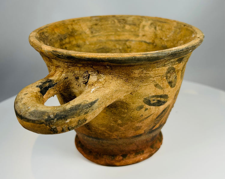 Archaic Etruscan pottery with radial floral decoration and pedestal base