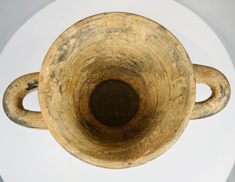 Ancient Etruscan cup with geometric motifs and archaeological wear