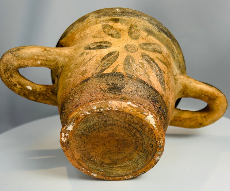 Mediterranean terracotta vessel with twin handles and floral design