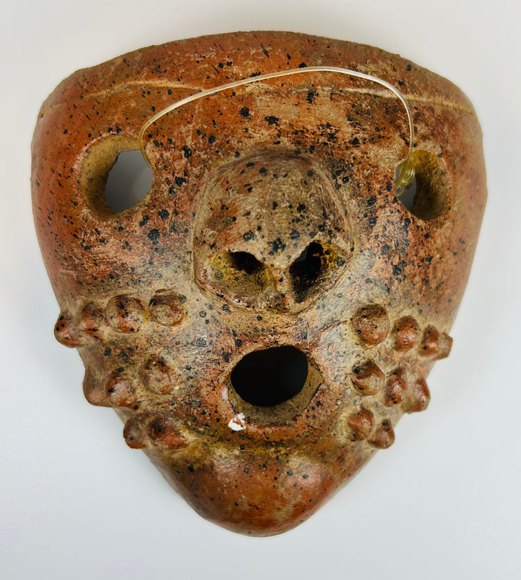 Ancient Mesoamerican clay mask with large mouth opening and patina