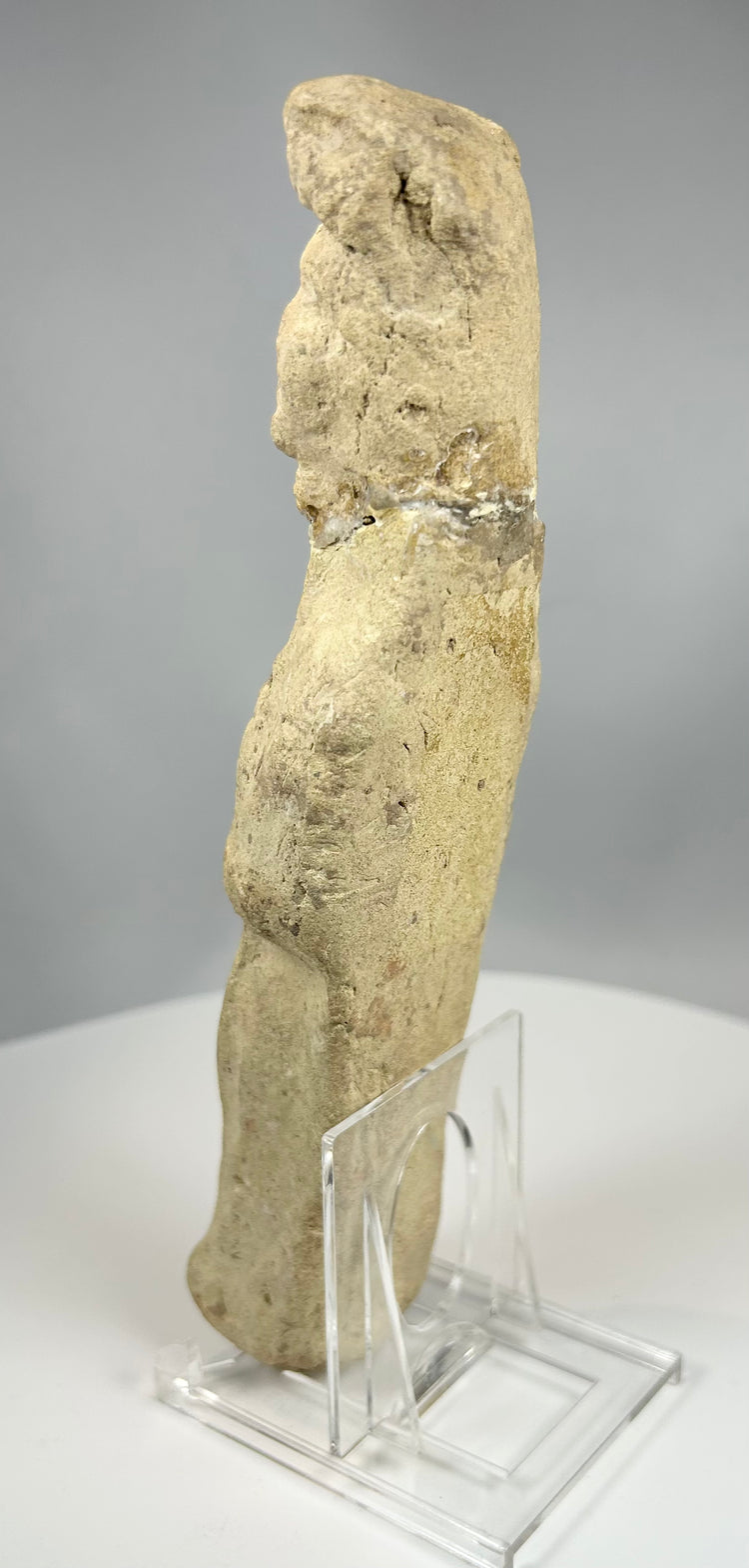 Terracotta female figure with mineral deposits and burial patina