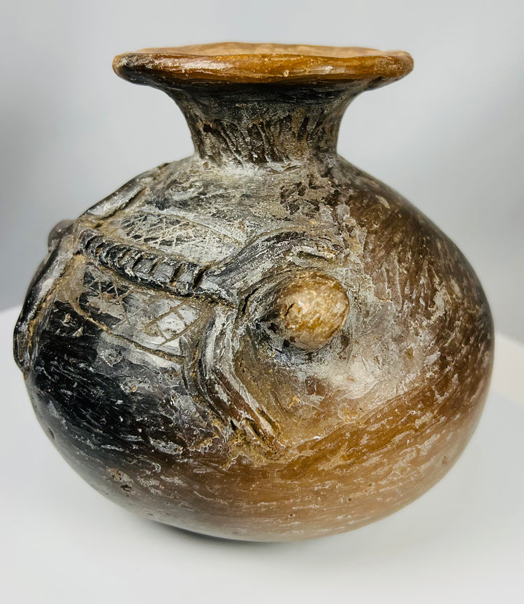 Pre-Columbian Central American vessel with geometric band and relief design