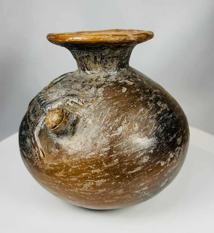 Terracotta ritual vessel with reptilian figures and burnished surface