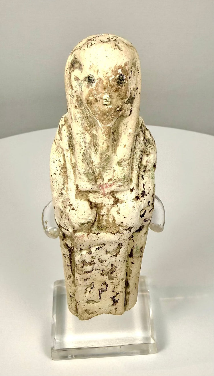 Ancient Egyptian funerary attendant featuring a pale cream limestone surface with natural brown discoloration and age-related wear.