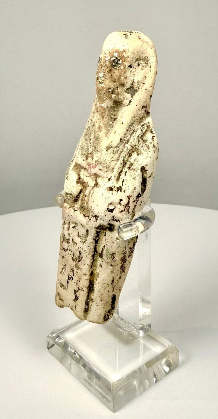 Egyptian limestone funerary figurine featuring a bordered inscription panel with partially preserved hieroglyphic markings.