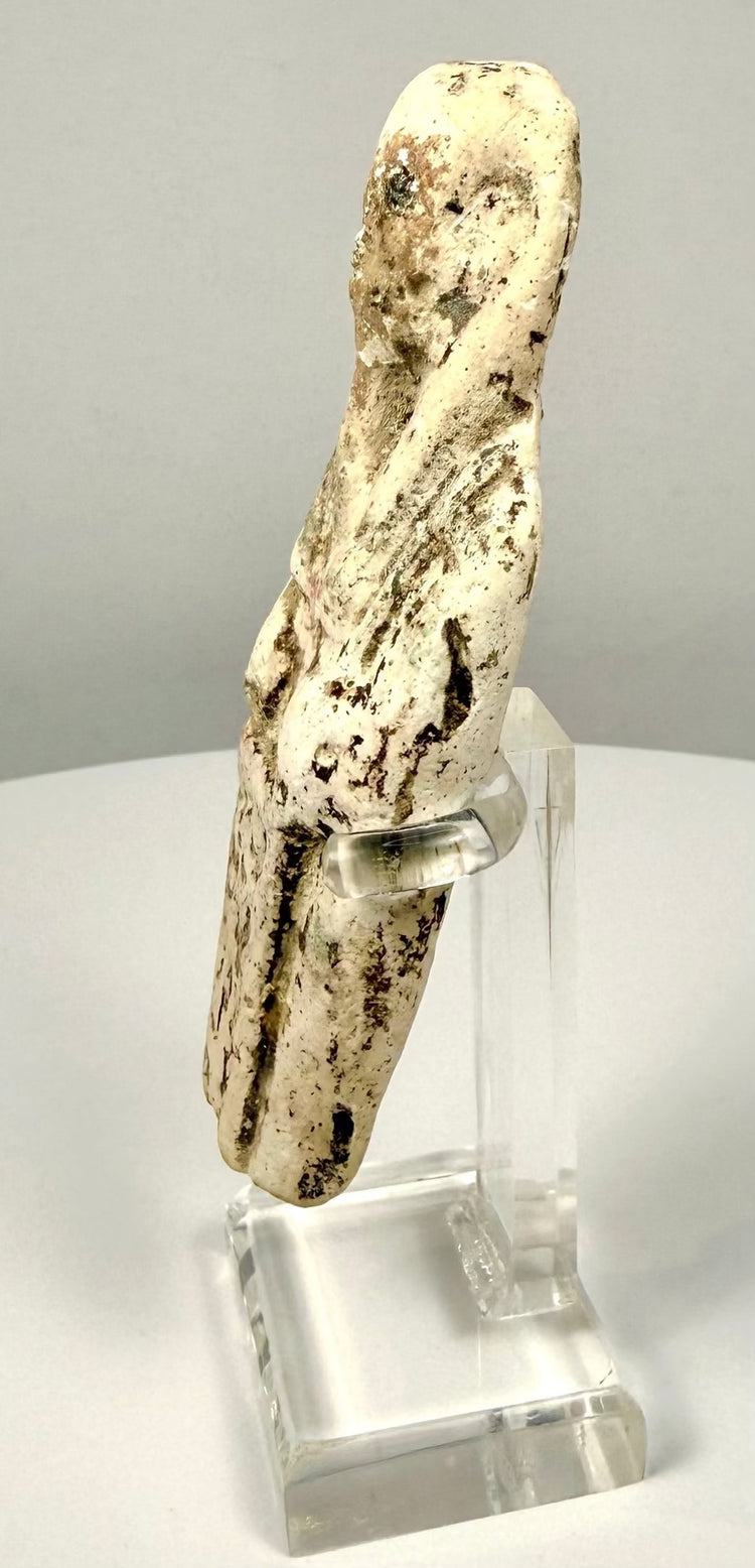 Ancient Egyptian ushabti with worn hieroglyphic inscriptions reflecting traditional burial practices and beliefs about the afterlife.