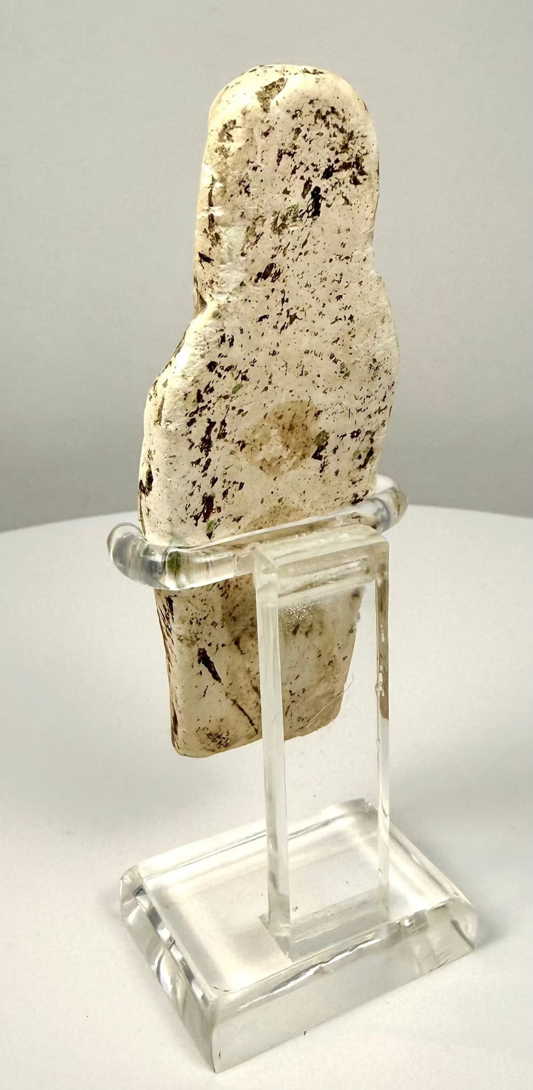 Egyptian mummiform funerary attendant with a closely wrapped body, elongated proportions, and traditional sculptural features.