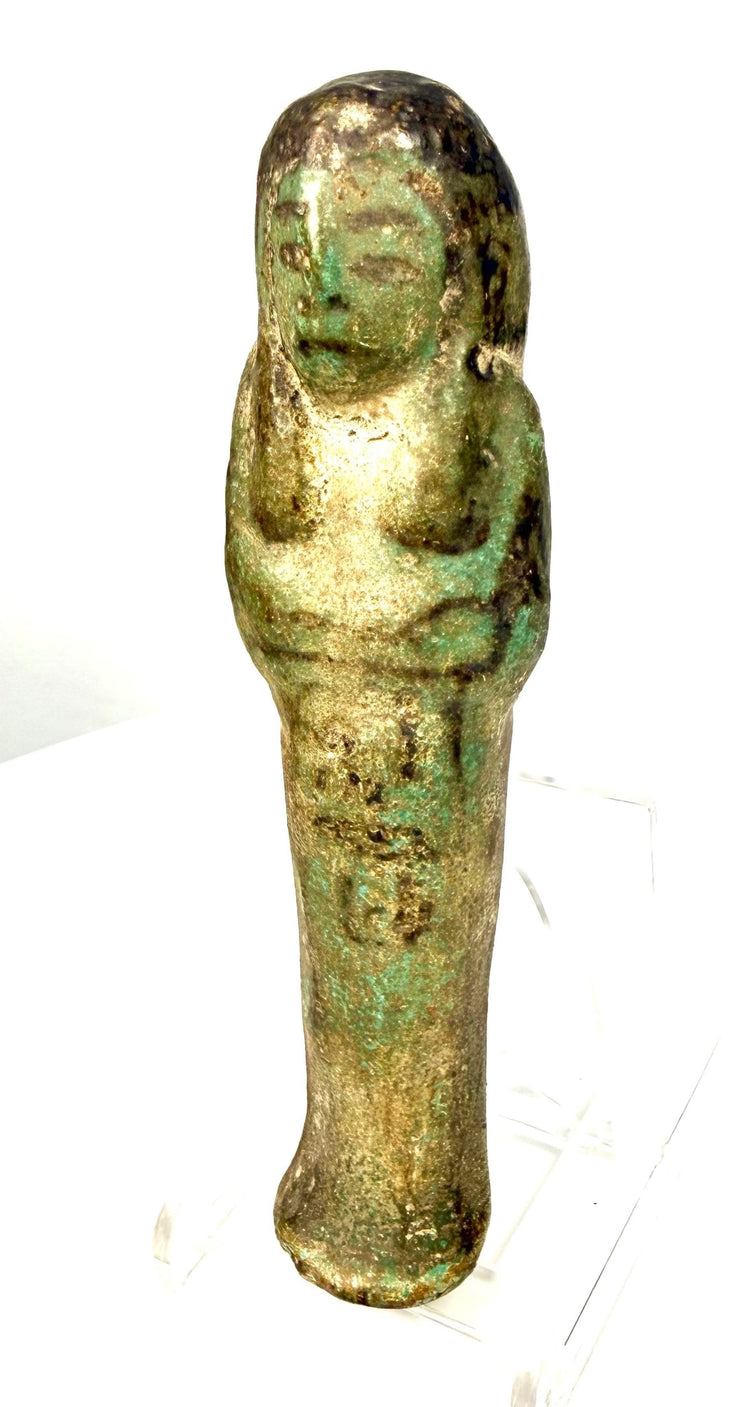 Egyptian faience shabti from the 21st–22nd Dynasties, featuring a slender mummiform body and surviving turquoise glaze.