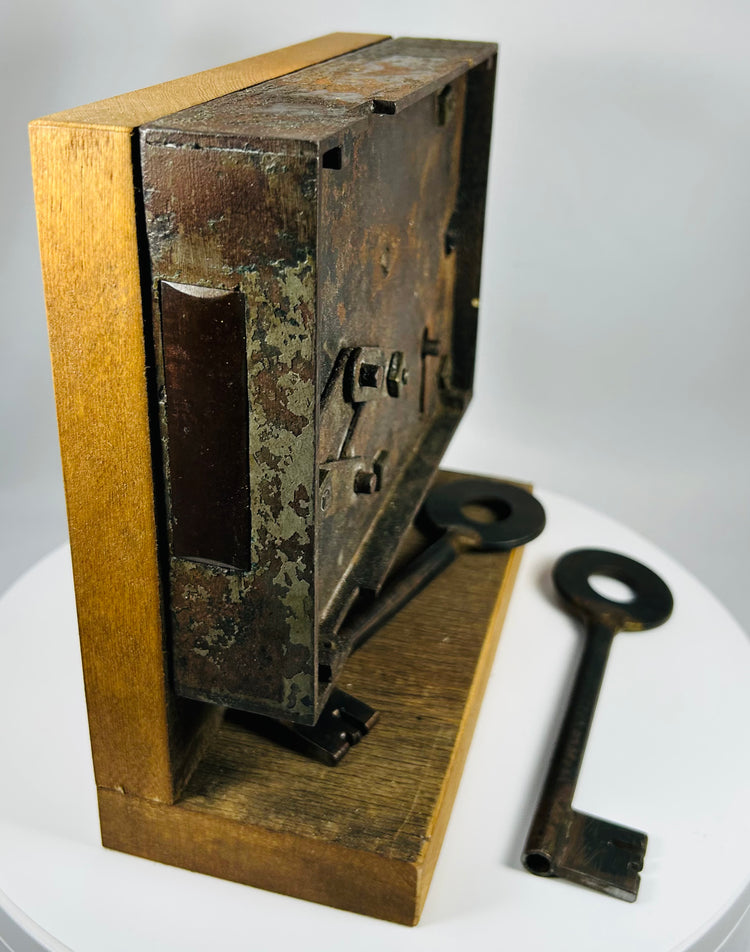 Vintage iron lock mechanism with warded system and display base