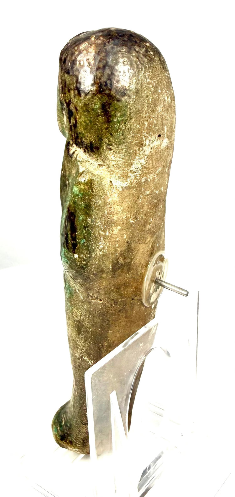 Ancient Egyptian faience ushabti displaying modelled facial features with traces of black-painted eyes and eyebrows.