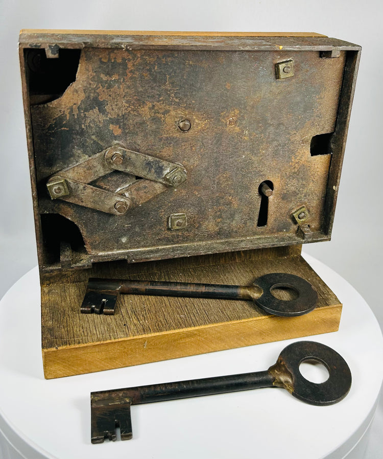 Antique iron door lock with mechanical components and aged surface