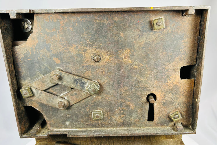Historic rim lock with key and exposed locking mechanism