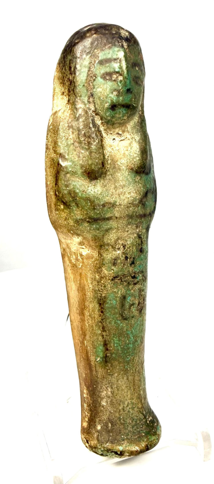 Blue-green Egyptian ushabti with crossed hands and decorative black pigment remaining across the mummiform body.