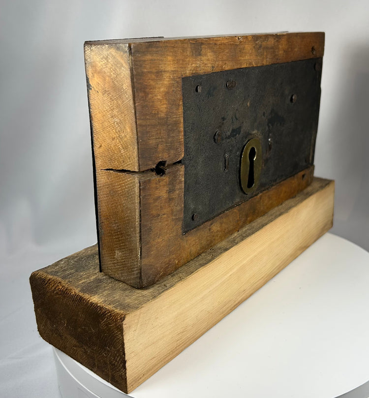 Historic rim lock with hand forged iron plates and wood housing