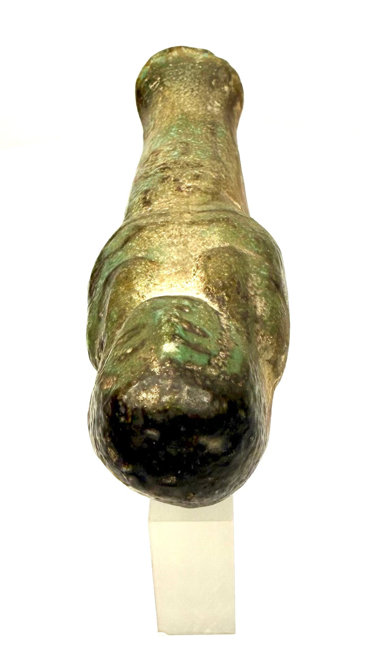 Blue-green glazed Egyptian ushabti representing a symbolic servant intended to perform agricultural labour in the afterlife.