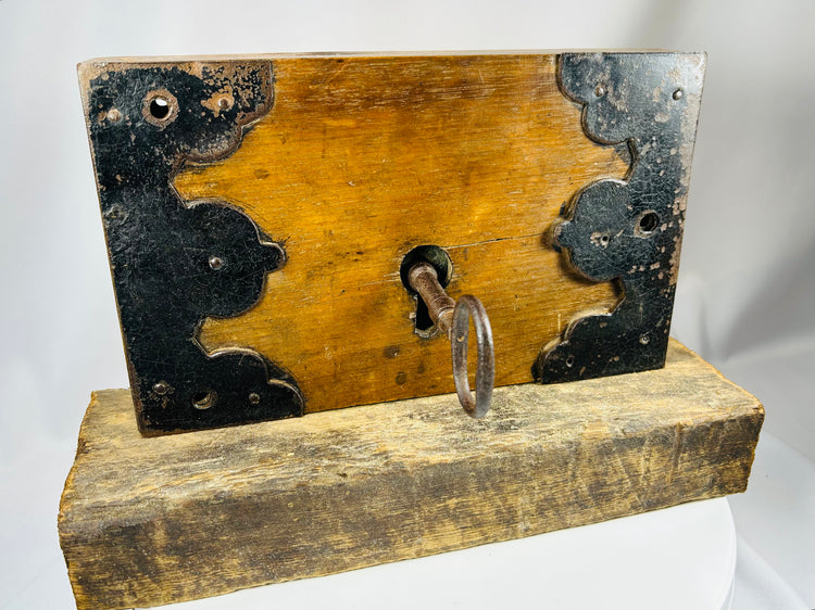 Warded lock mechanism with iron key and wooden housing