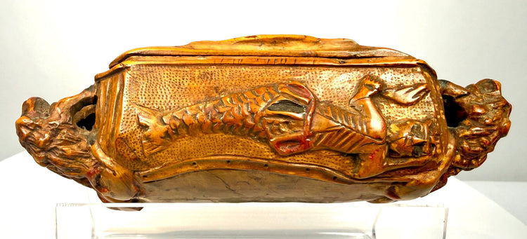 Antique Italian table snuff box featuring deep-relief hunting imagery against a densely stippled and textured wooden background.