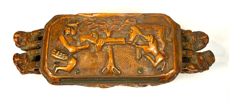 Late 19th-century Italian hardwood tobacco box with finely incised hunting figures and decorative narrative carvings across the lid.