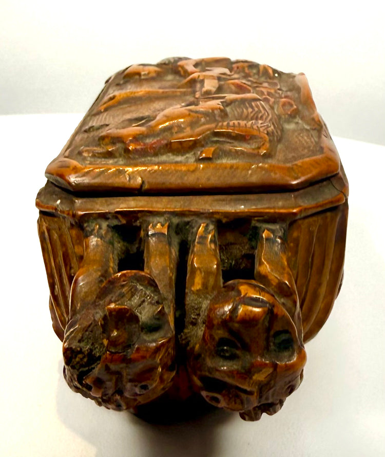 Nineteenth-century Italian carved tobacco box featuring a substantial metal hinge with visible fasteners and age-related oxidation.
