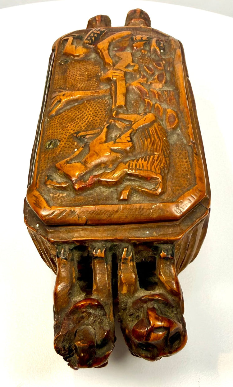 Antique Italian wooden snuff box exhibiting warm honey-brown patination, darkened incised details, and naturally aged surfaces.