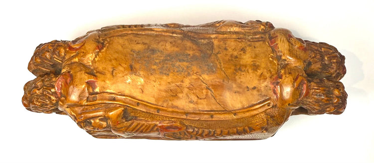 Antique Italian carved wooden tobacco box showing surface rubbing, small losses, age-related cracking, and weathered sculptural details.