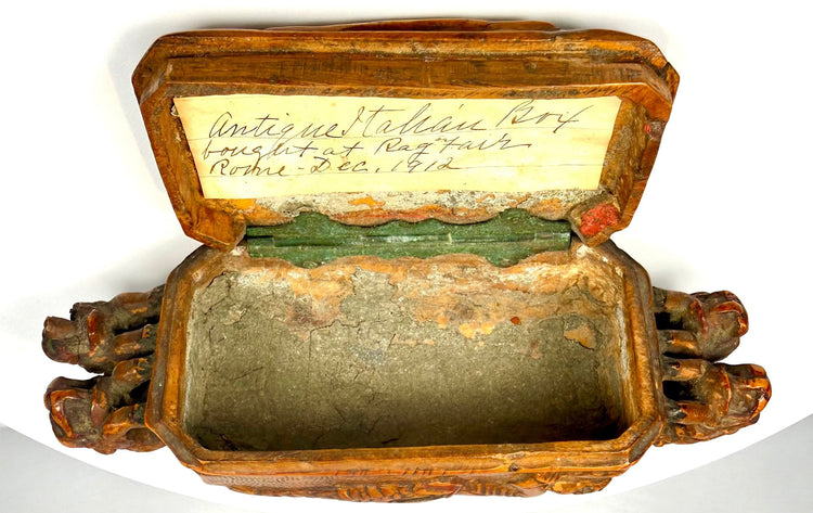 Italian Victorian-era table snuff box featuring sculptural beast-like heads projecting from both ends of its rectangular body.