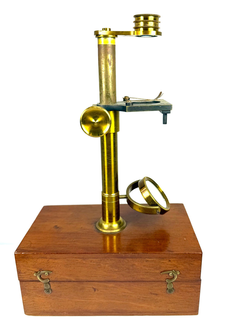 19th-century dissecting microscope accompanied by brass-mounted optical fittings, removable magnifying lenses and scientific accessories.
