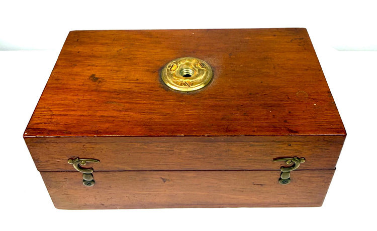 Antique Victorian microscope optical accessories including circular brass lens mounts and precision-crafted threaded fittings.
