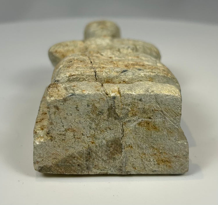 Early Dynastic Mesopotamian carved stone figure with weathered surface