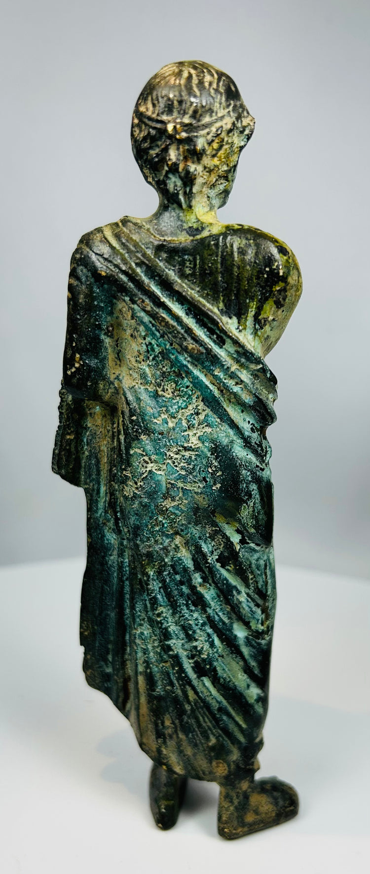 Antique European bronze classical figure with detailed toga folds and aged patina