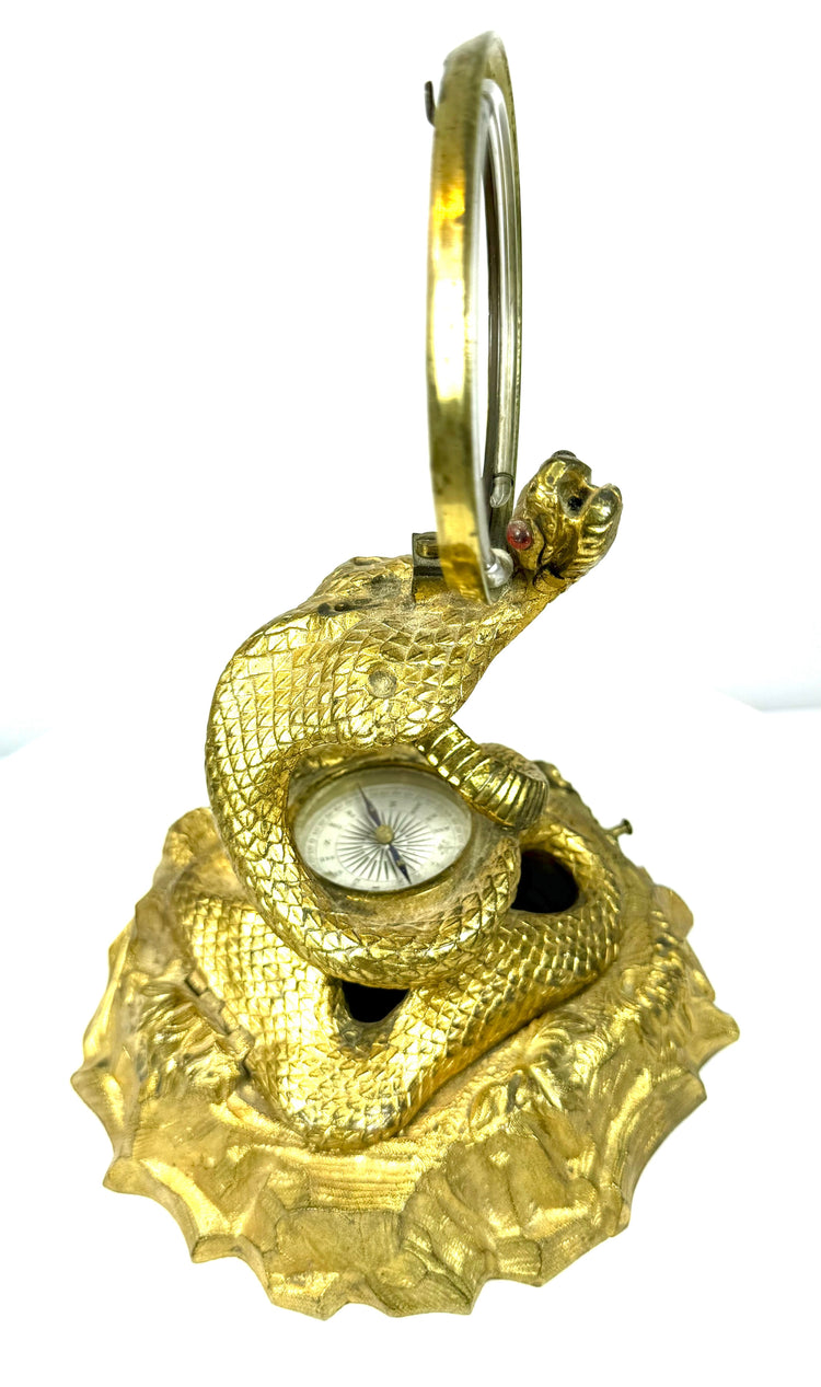 Antique Victorian cobra inkstand with detailed gilt bronze scales, expanded hood, and distinctive red inset eyes.