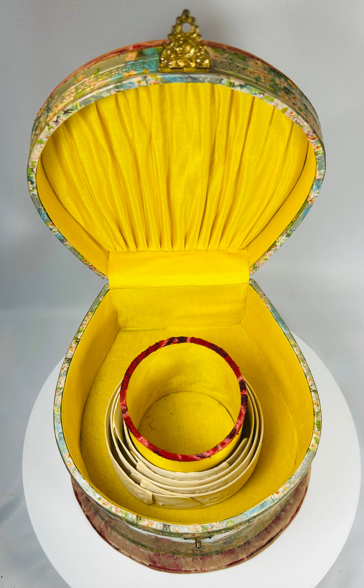 Decorative celluloid collar case with pleated silk interior and collar holder insert