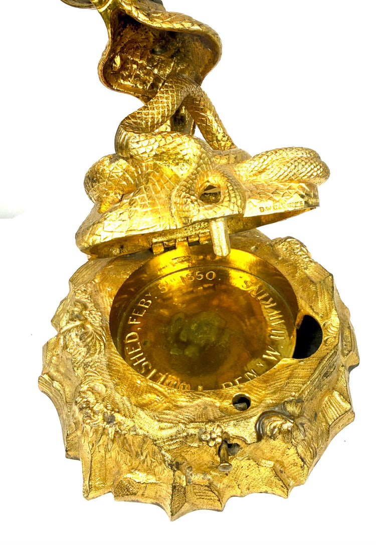 Antique gilt bronze cobra inkstand with integrated writing instrument openings and elaborate naturalistic foliage decoration.