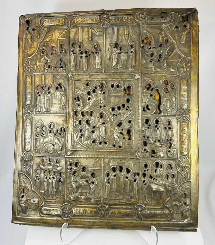 Multi-scene Russian religious icon with chased metal oklad and Church Slavonic inscriptions