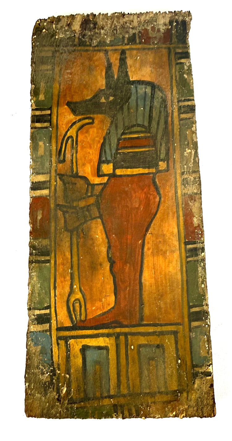 Ancient Egyptian painted funerary artifact depicting Duamutef holding a curved ritual element associated with Egyptian mortuary traditions.