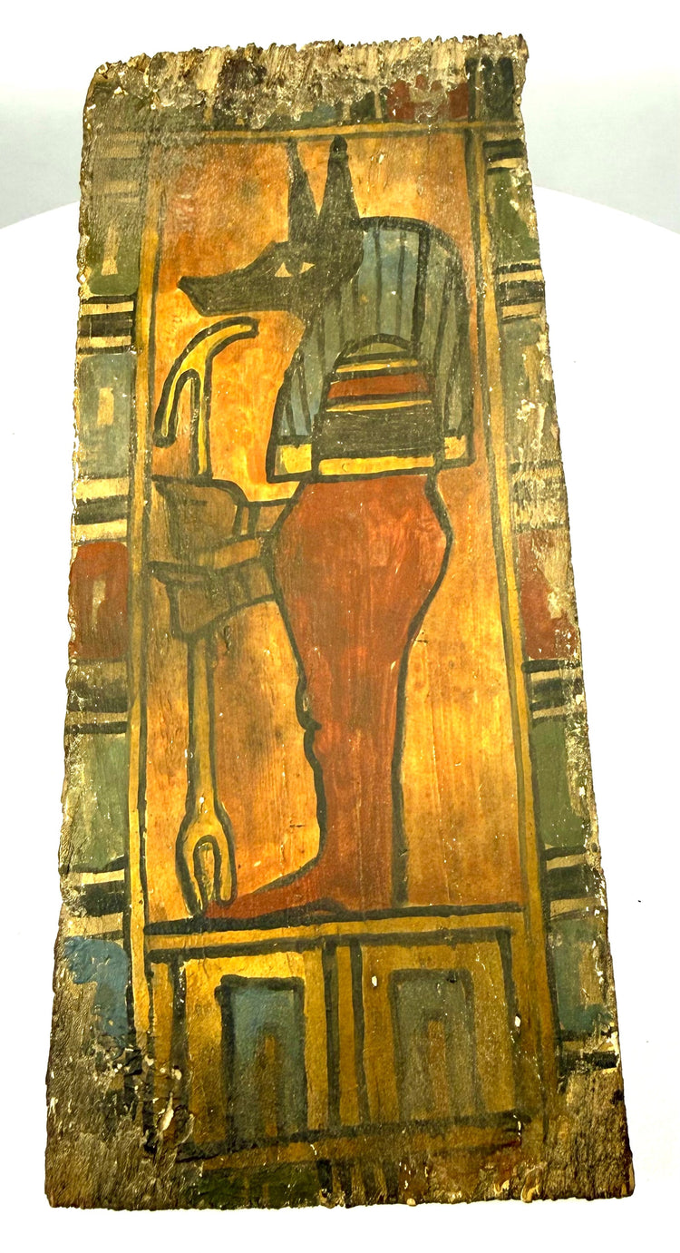 Egyptian Ptolemaic wooden funerary panel with irregular fragmentary edges, exposed wooden substrate, and surviving ancient painted decoration.