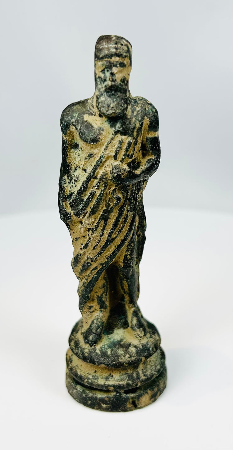 Neoclassical bronze sculpture of standing male figure with aged patina