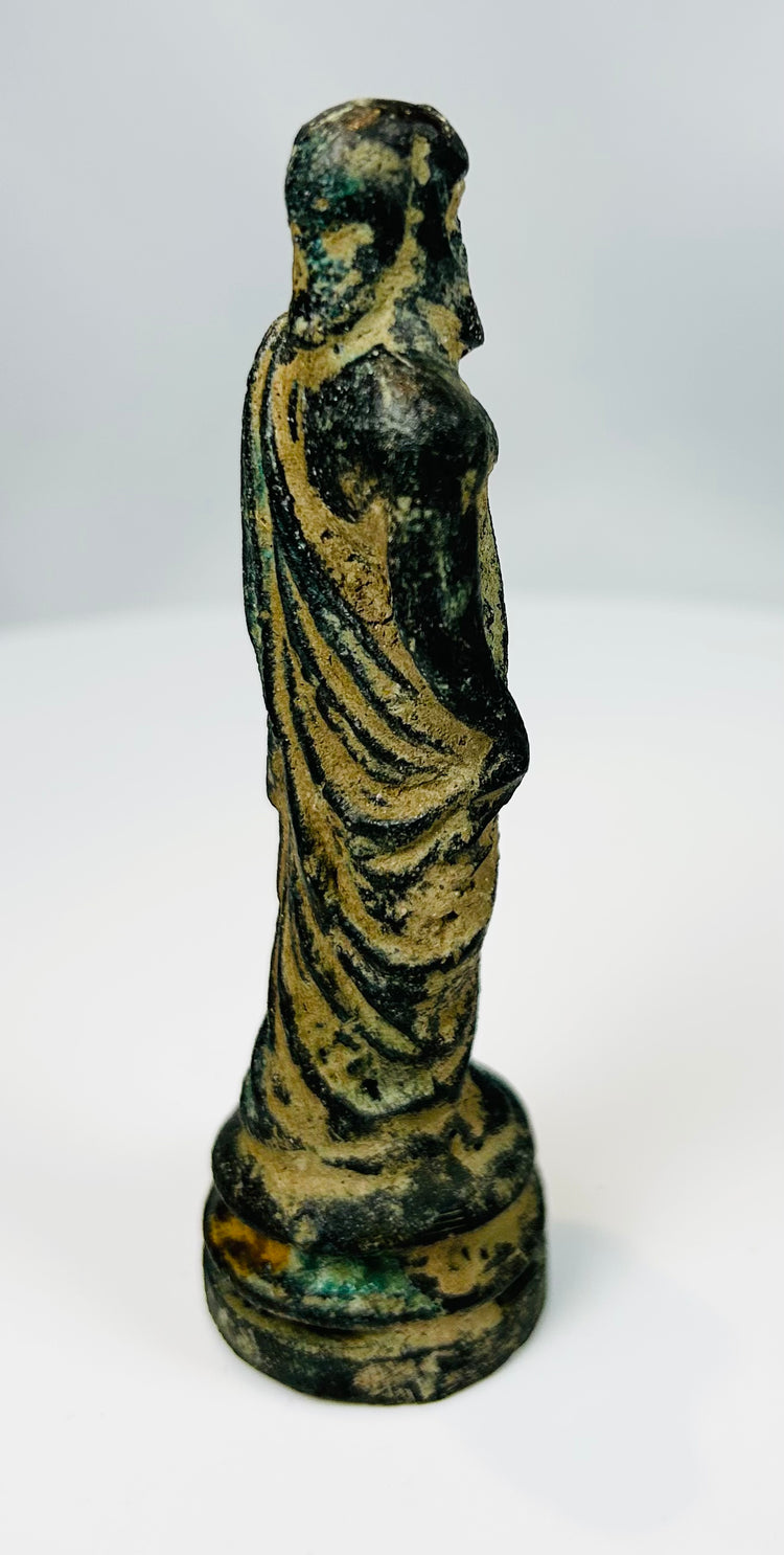 Antique bronze sculpture of bearded man in classical toga style