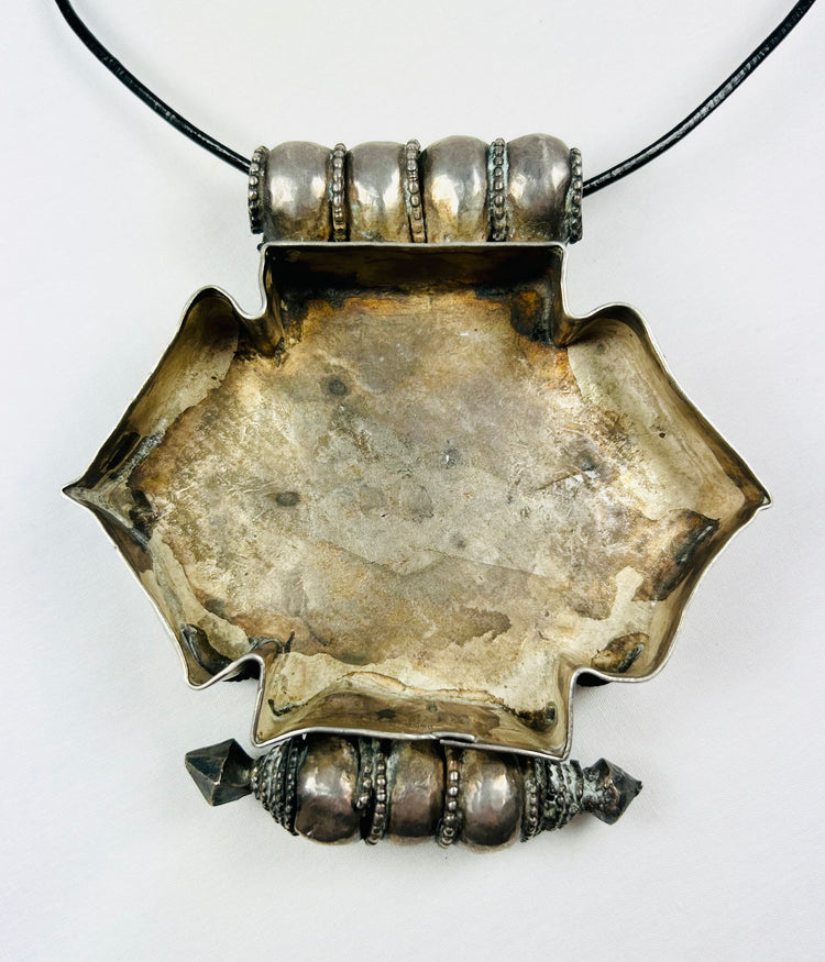 Late 19th–early 20th century Tibetan/Nepalese gau pendant, hexagonal, parcel-gilt filigree