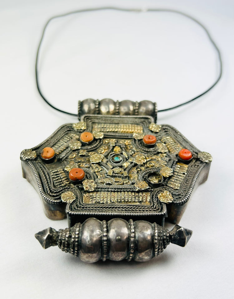 Hexagonal Tibetan-Nepalese gau pendant, hollow reliquary, coral and turquoise details, parcel-gilt design