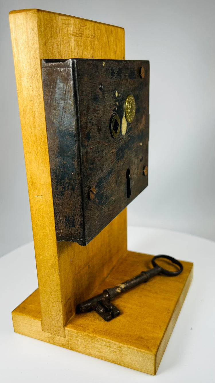 Early American iron door lock with original key and aged patina