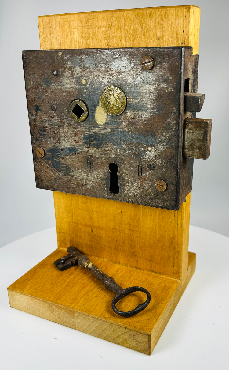 Forged iron door lock with original key and Carpenter Co patentees mark