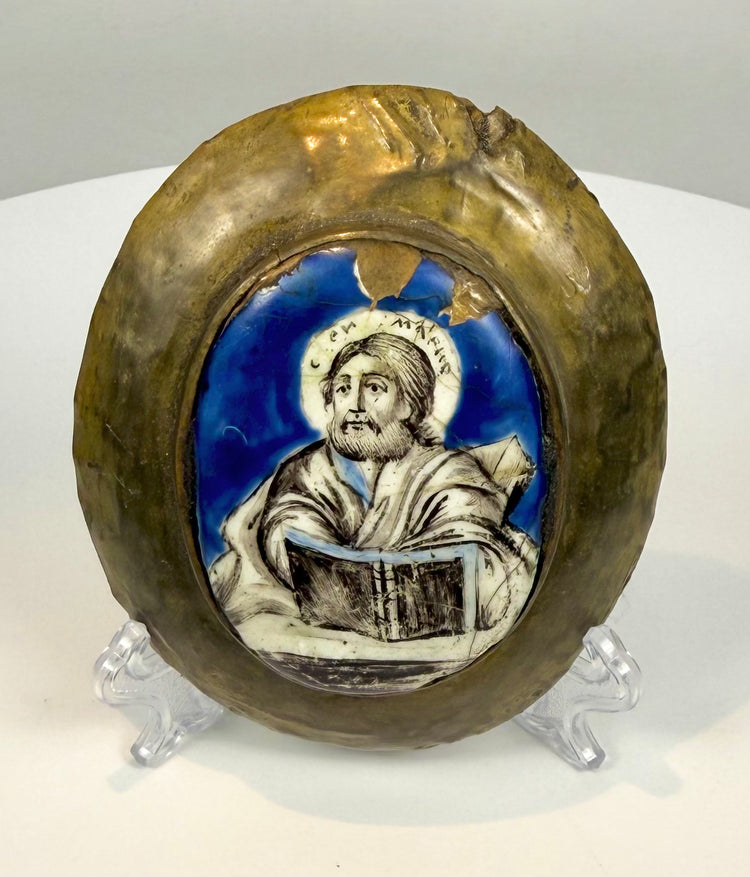 Antique Russian enamel religious plaque displaying a broad bronze-catalogued frame with golden-brown patina, surface wear, and decorative oval construction.