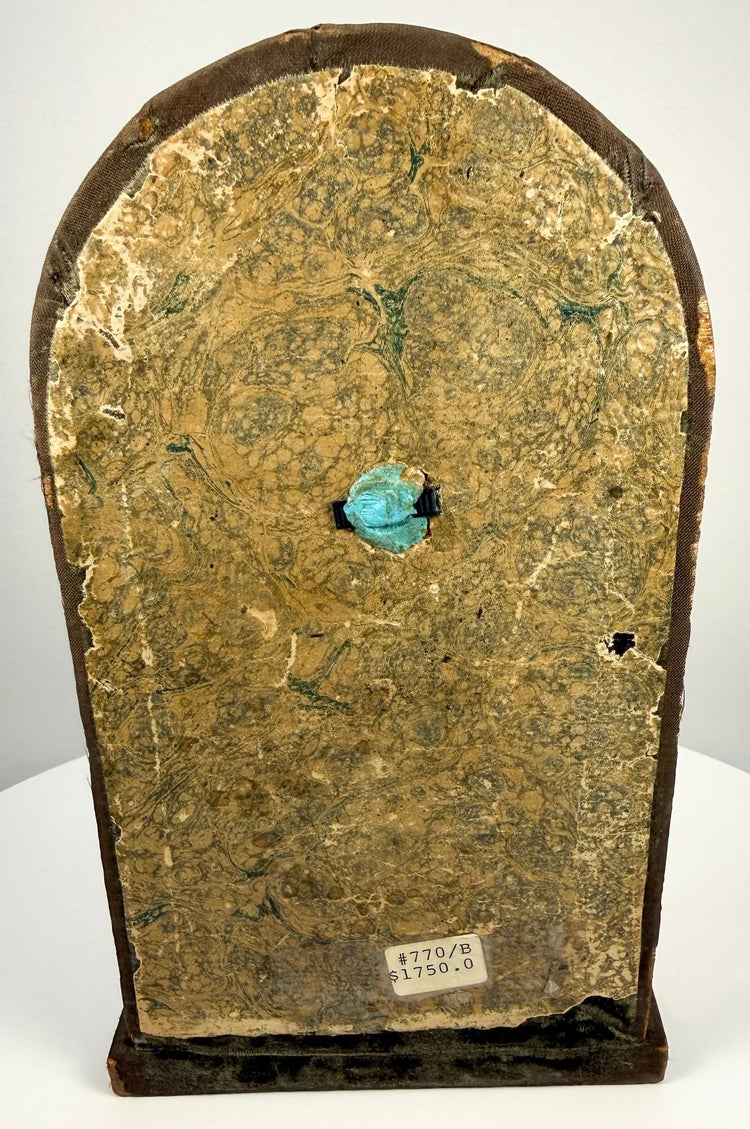 Antique Northern Italian Minerva bronze displaying age-related gilding wear, darkened patination, and sculptural details against a fabric-covered wooden backing.