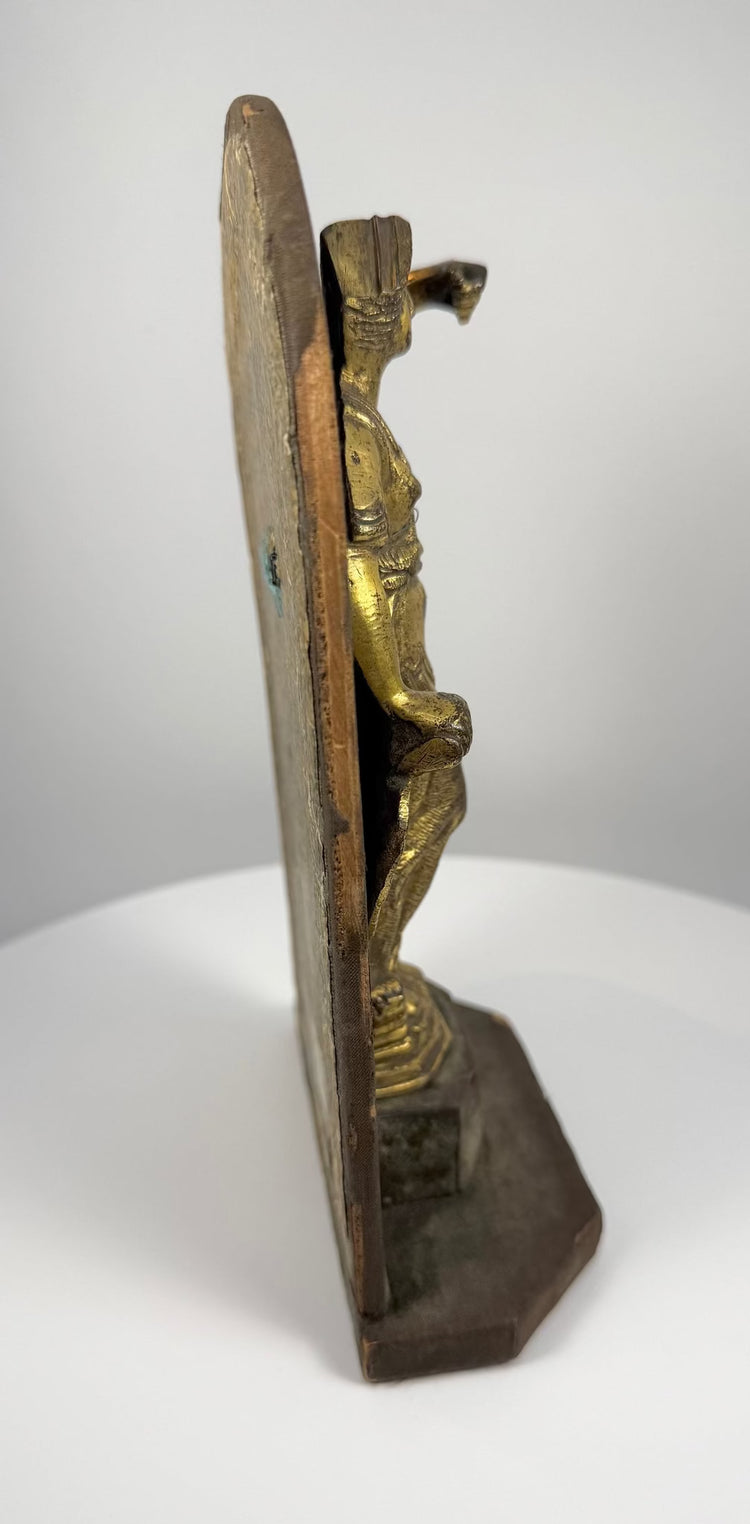 Italian Baroque bronze goddess sculpture with golden surface patination, intricate ornamental swags, and finely detailed classical armour and drapery.