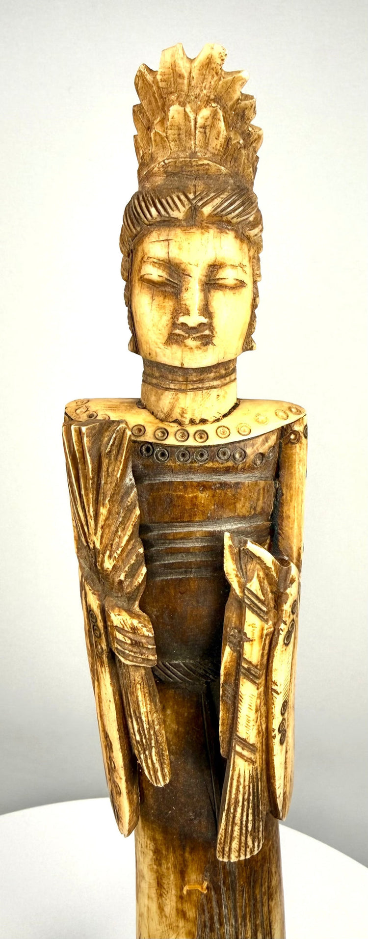 Chinese carved-bone Emperor figurine featuring a long beard, expressive moustache, tall cylindrical headdress, and traditional imperial-style robes.