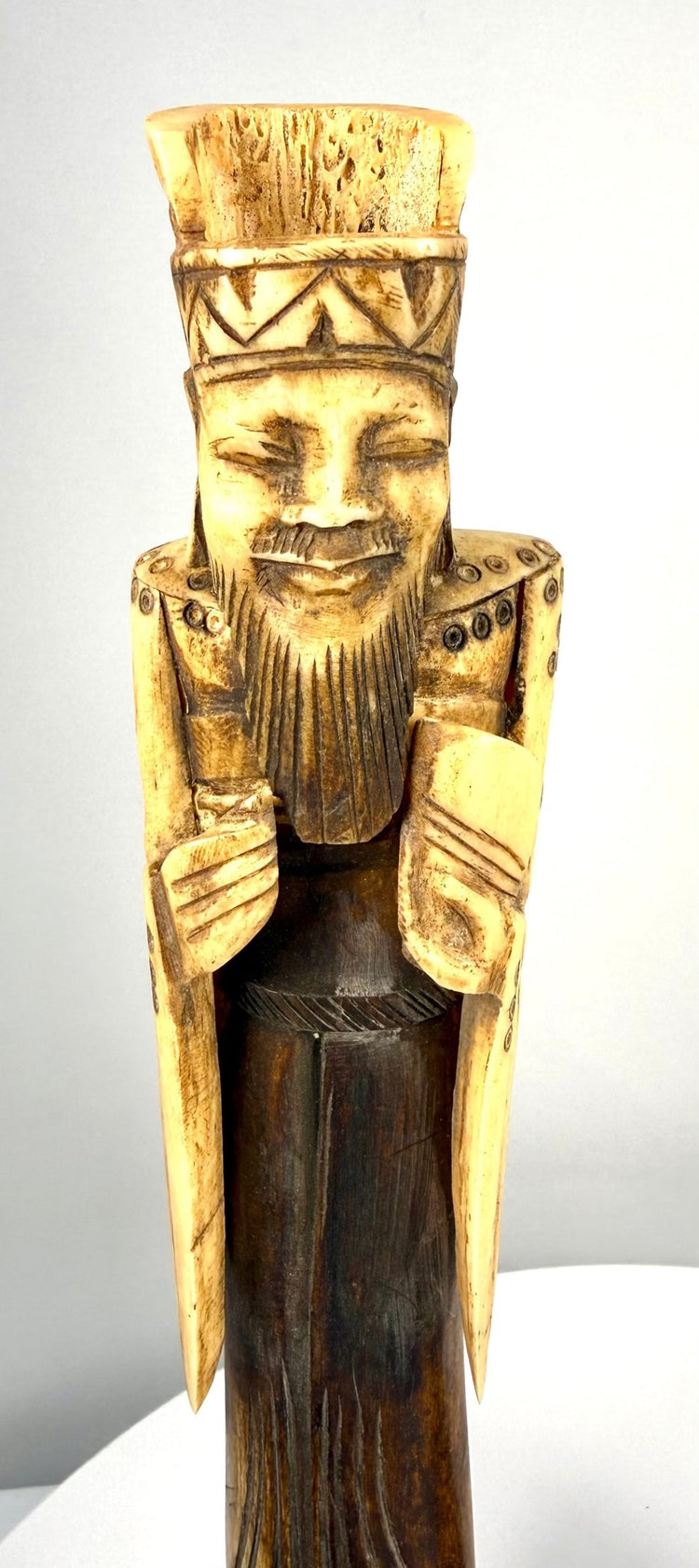 Vintage Chinese Empress bone sculpture displaying an elaborate crown, serene facial expression, flowing ceremonial garments, and finely carved accessories.