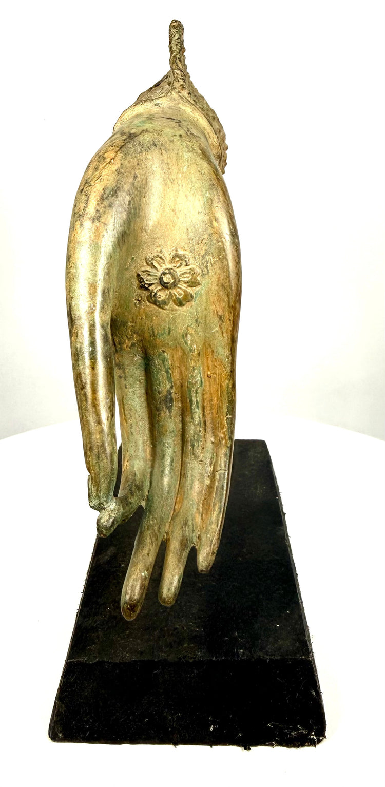 Thai bronze Buddha hand displaying a gesture associated with Vitarka Mudra, symbolizing spiritual teaching, wisdom, and the transmission of Buddhist knowledge.